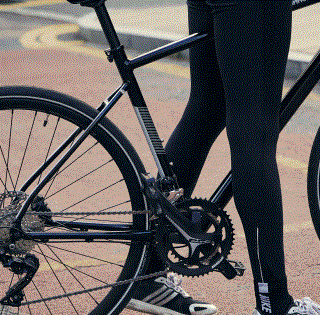 a person's legs and a bicycle