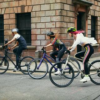 a group of people riding bikes