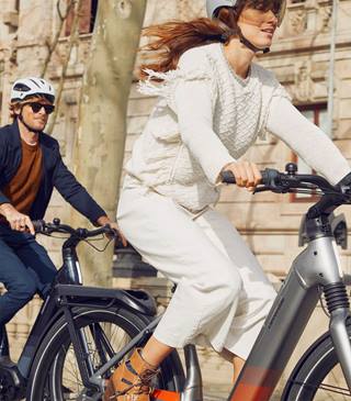 a man and a woman riding bikes