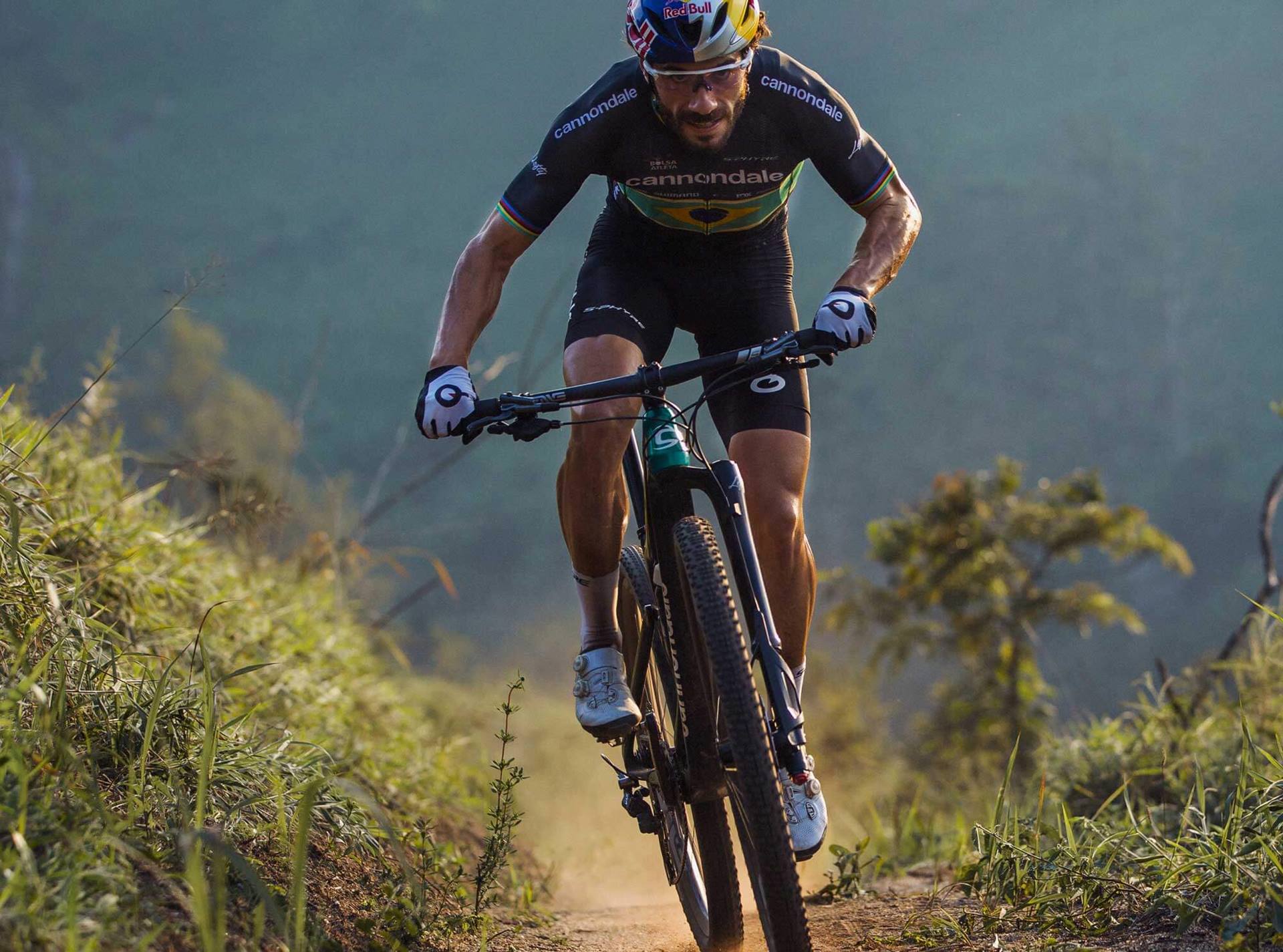 a man riding a bike on a dirt trail