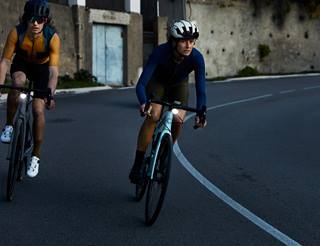 a couple of people riding bikes