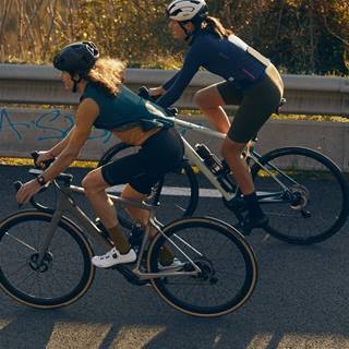 a couple of women riding bikes